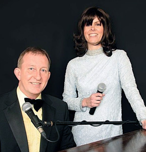 Mick Rose playing the piano at a function