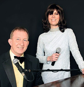 Mick Rose playing the piano at a function